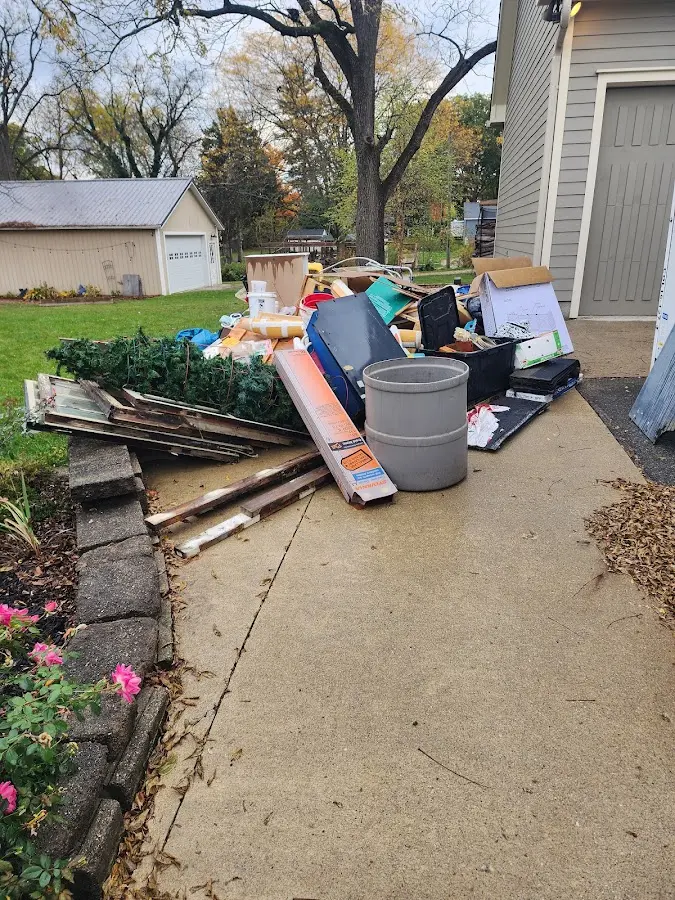 Dumpster being loaded with debris for 3 Yard Dumpster Rental in Bellwood